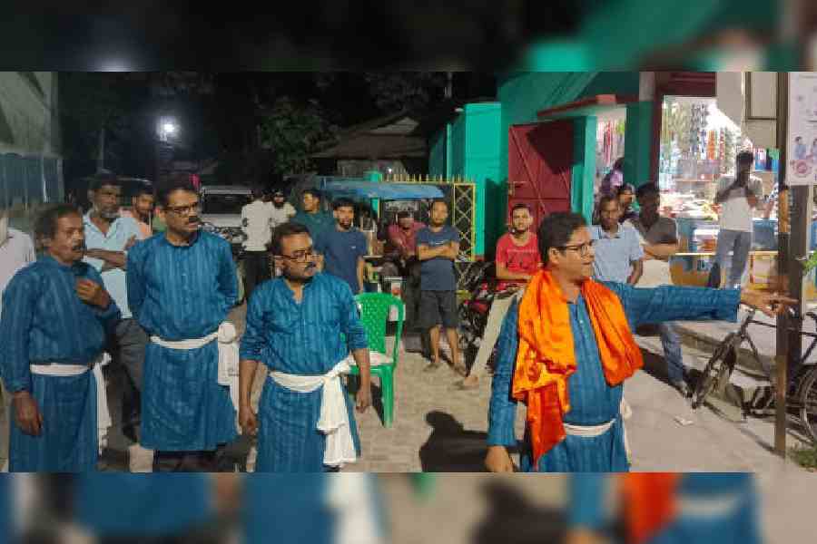 Theatre artistes perform the street play at Putimari in support of Udayan Guha, the Trinamool Congress candidate from the Dinhata Assembly constituency of Cooch Behar.  Picture by Main Uddin Chisti