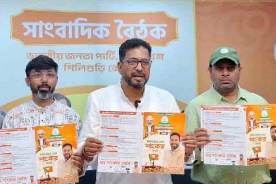 Shankar Ghosh (centre) releases his manifesto in Siliguri on Saturday. 
