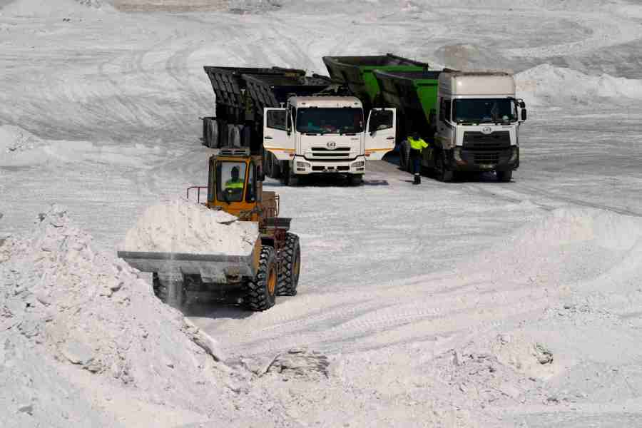 A front-end loader transports phosphogypsum in Phalaborwa, South Africa, Monday, Sept. 8, 2025.