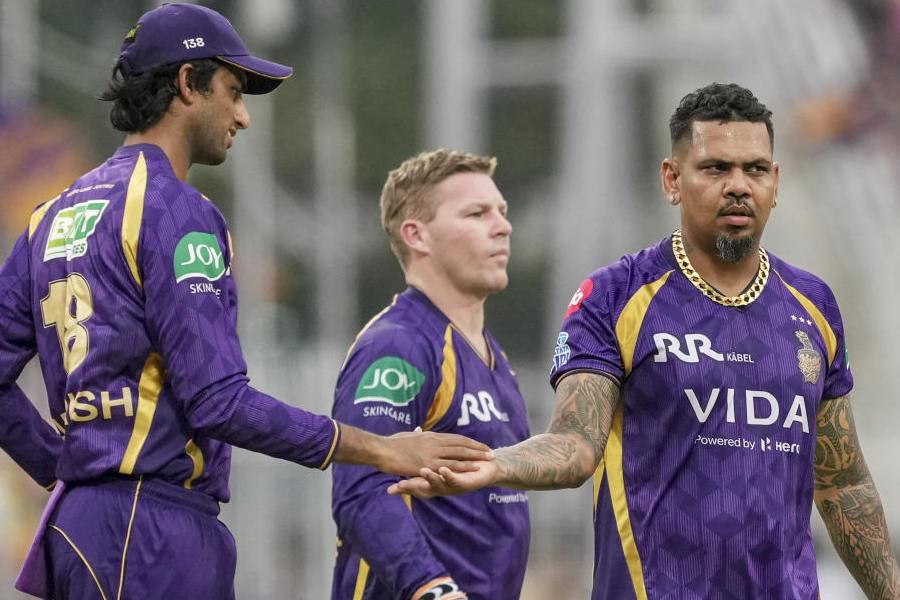 Kolkata Knight Riders' Sunil Narine, right, with teammates celebrates after taking the wicket of Rajasthan Royals' Donovan Ferreira during the Indian Premier League (IPL) 2026 T20 cricket match between Kolkata Knight Riders and Rajasthan Royals, at Eden Gardens in Kolkata, West Bengal, Sunday, April 19, 2026.