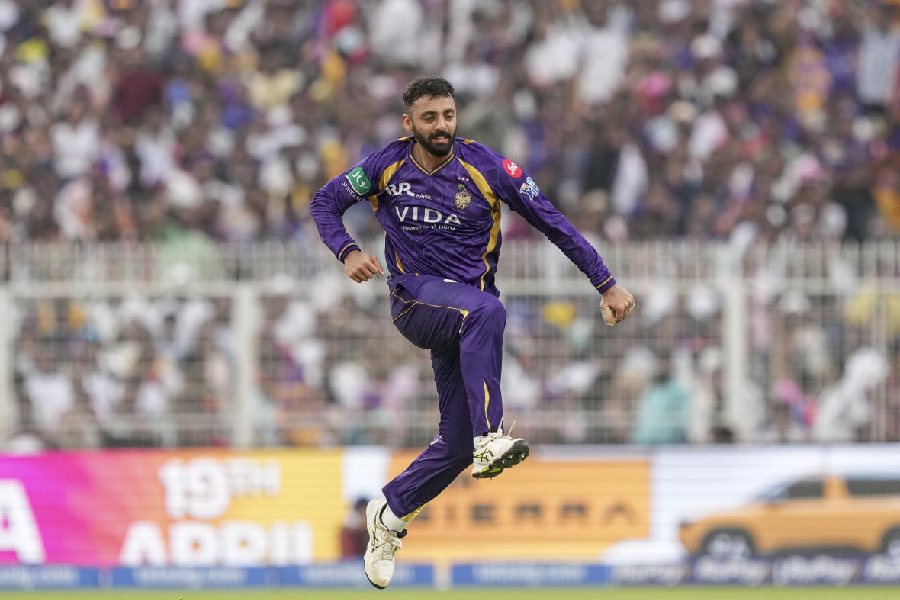 Kolkata Knight Riders' Varun Chakravarthy celebrates after taking the wicket of Rajasthan Royals' captain Riyan Parag during the Indian Premier League (IPL) 2026 T20 cricket match between Kolkata Knight Riders and Rajasthan Royals, at Eden Gardens in Kolkata, West Bengal, Sunday, April 19, 2026.