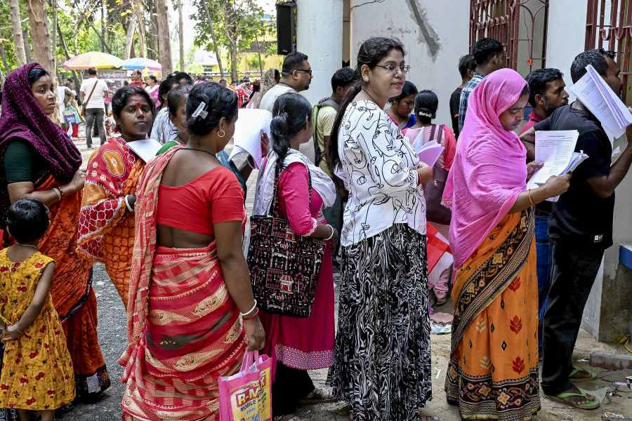 People wait to submit petitions before a special tribunal after their names were deleted from the Special Intensive Revision final voter list ahead of the West Bengal Assembly elections, in Ranaghat, Nadia district, Monday, April 20, 2026.