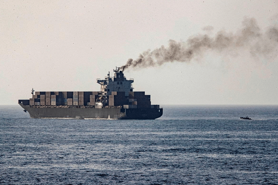 U.S forces patrol near the Iranian-flagged cargo ship M/V Touska after it was boarded and seized by U.S. forces on Sunday, at a location given as the Arabian Sea, in this handout image released April 20, 2026.
