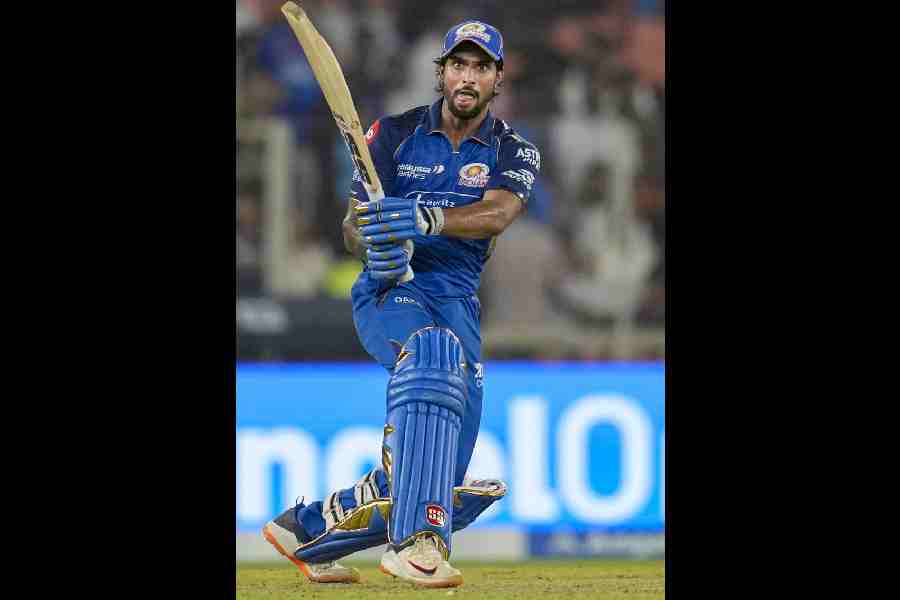 Mumbai Indians’ Tilak Varma smashes his way to an unbeaten 101 against Gujarat Titans on Monday.