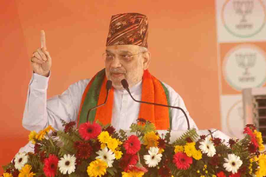 Amit Shah addresses the public meeting in Sukna on Tuesday. 