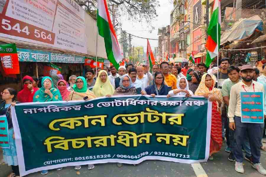 Erosion victims, whose names were put in the under adjudication category during the SIR process and later deleted, walk in a rally for their voting rights in Malda town in March