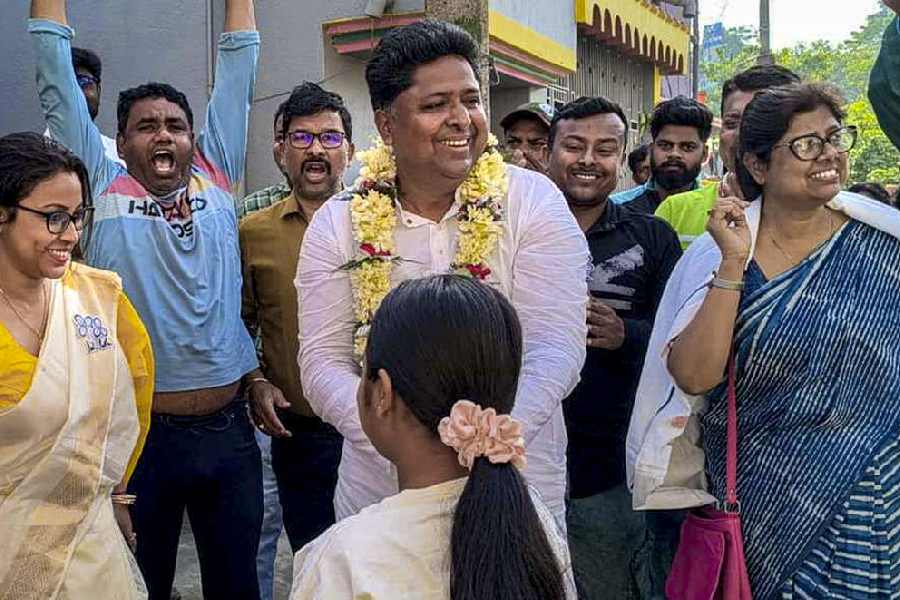TMC candidate from English Bazar constituency, Ashish Kundu, interacts with people during a campaign ahead of West Bengal Assembly elections, in Malda, West Bengal, Sunday, April 12, 2026.