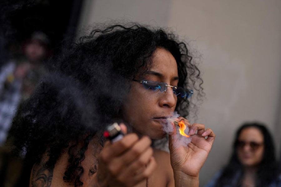 An enthusiast marks the informal annual cannabis holiday, 4/20 (four-twenty), corresponding to the numerical figure widely recognized within the cannabis subculture as a symbol for all things related to marijuana, at Dazed Cannabis dispensary in New York City, U.S., April 20, 2024