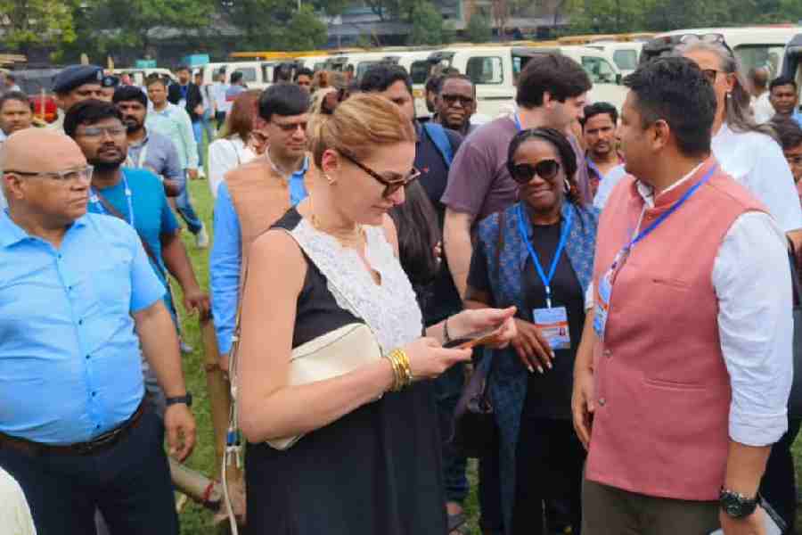 Foreign delegates on Wesdesday visit the Siliguri College campus, which is a distribution-cum-receiving centre for poll items.