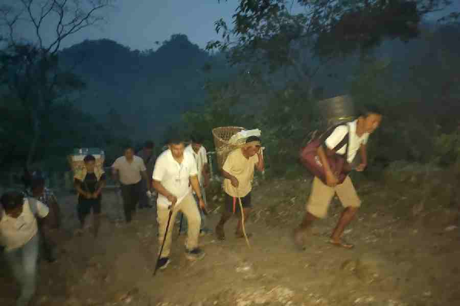 Polling personnel en route to the booths in the Buxa hills of Alipurduar district on Wednesday