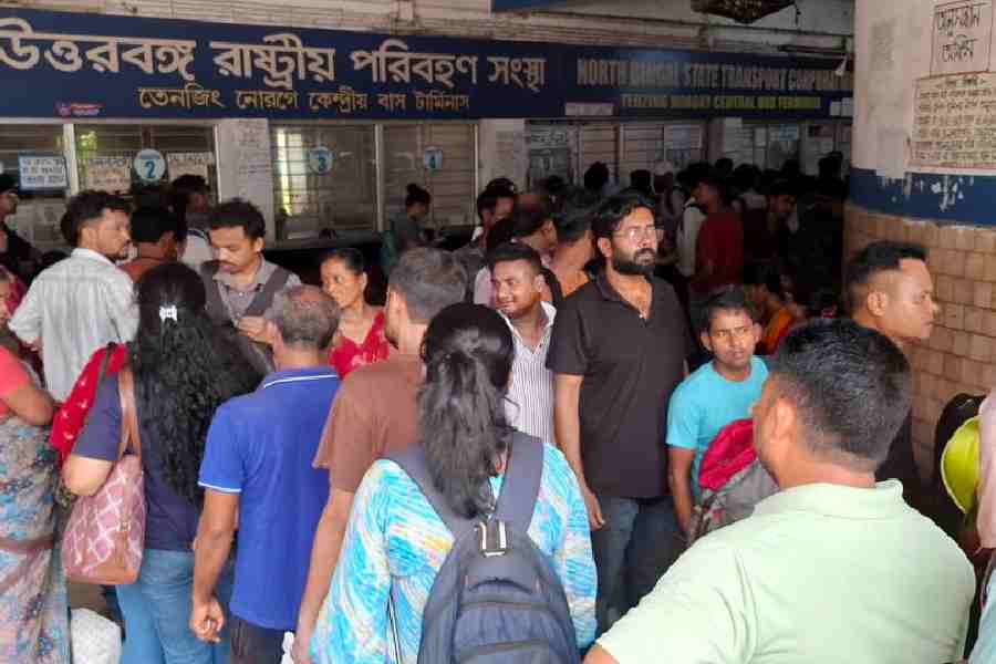 A queue for bus tickets at the Tenzing Norgay Central Bus Terminus in Siliguri on Wednesday. 
