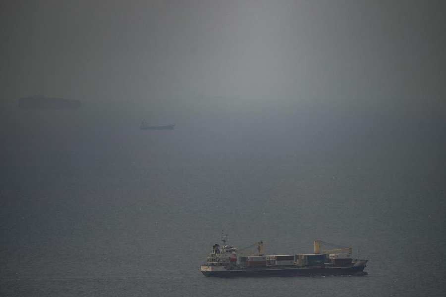 A cargo ship sails in the Persian Gulf toward the Strait of Hormuz, Wednesday, April 22, 2026.