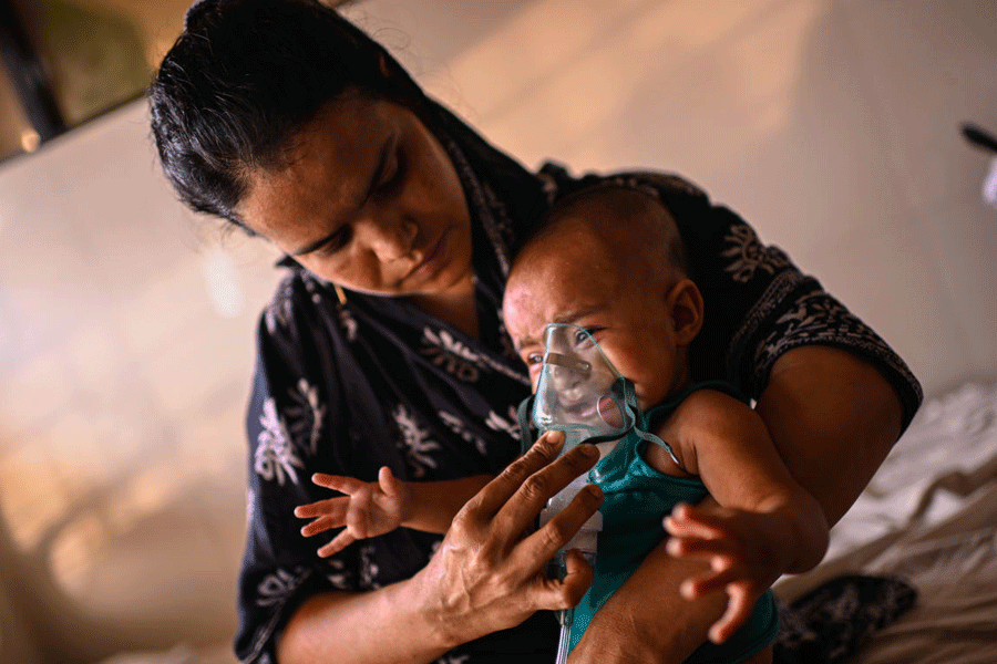 A mother administers a nebulizer treatment for her child suffering from measles at the Infectious Diseases Hospital in Dhaka, Bangladesh, Monday, April 6, 2026, amid a countrywide outbreak.