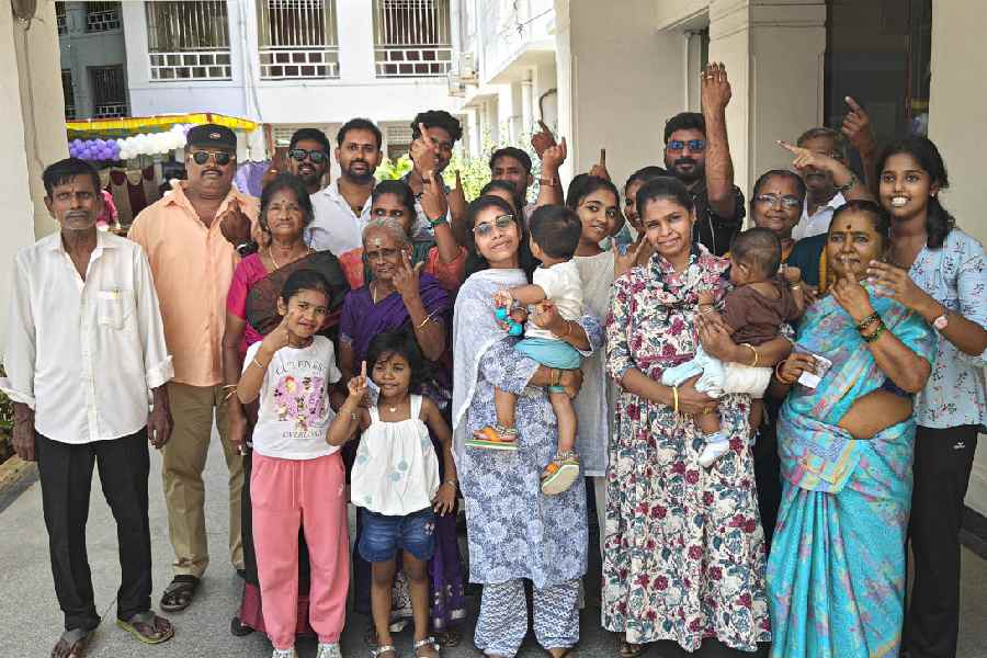 Members of a three-generation family show their inked fingers after casting votes at a polling station during the Tamil Nadu Assembly elections, in Chennai, Thursday, April 23, 2026.