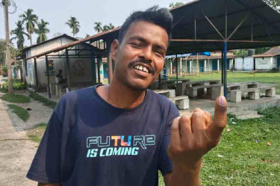 Suresh Baraik after casting his vote on the closed Madhu tea estate on Thursday