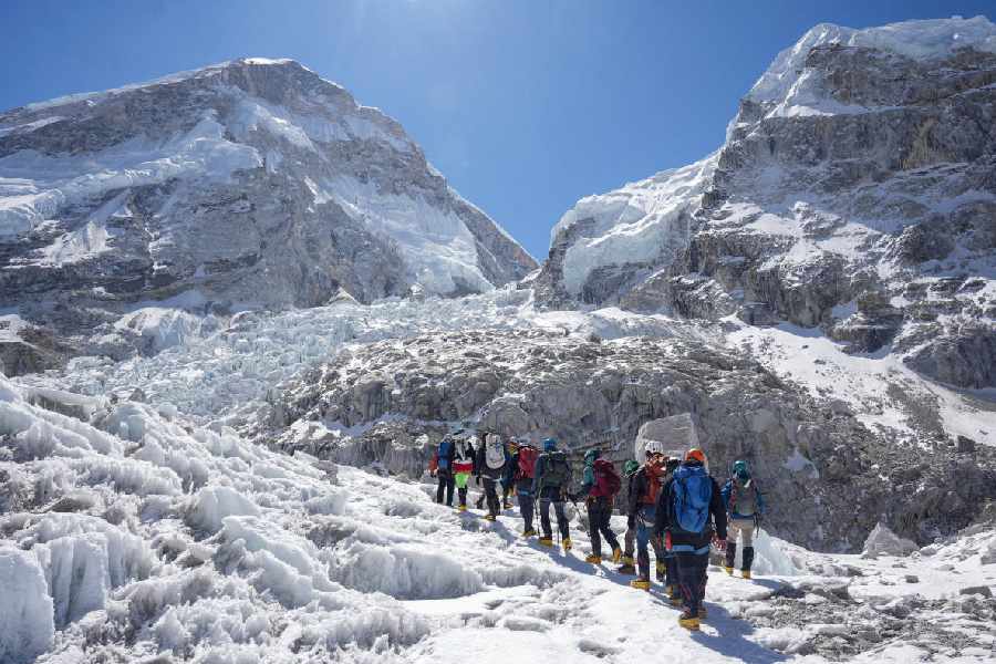 Members of an expedition team hike at Khumbu Icefall, as the route to Mount Everest Camp One has not yet been opened for the season in Solukhumbu district, also known as the Everest region, Nepal, April 22, 2026.