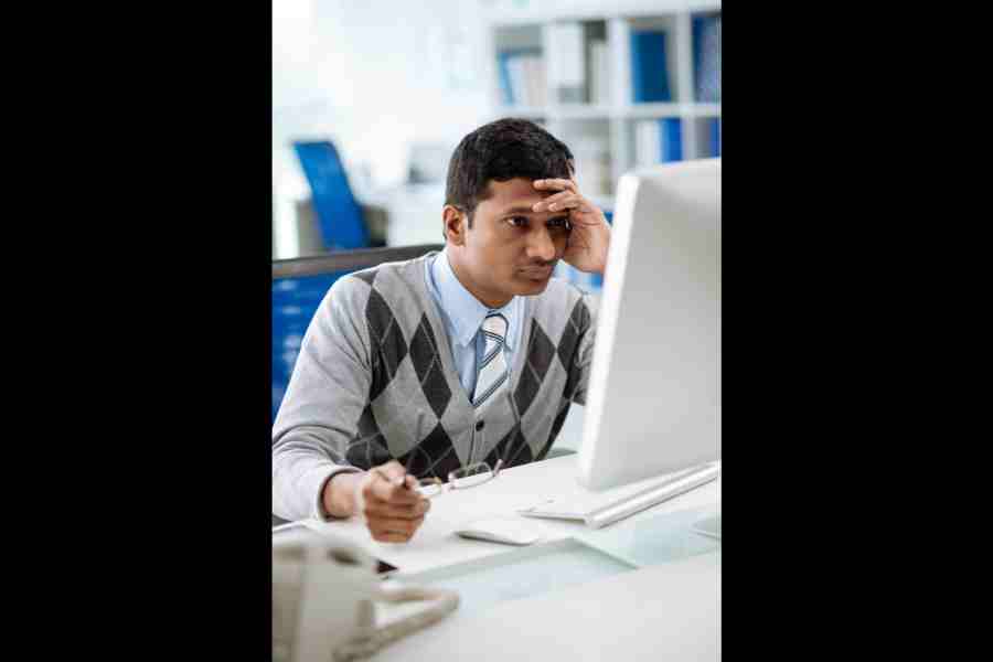 An employee working on a laptop.
