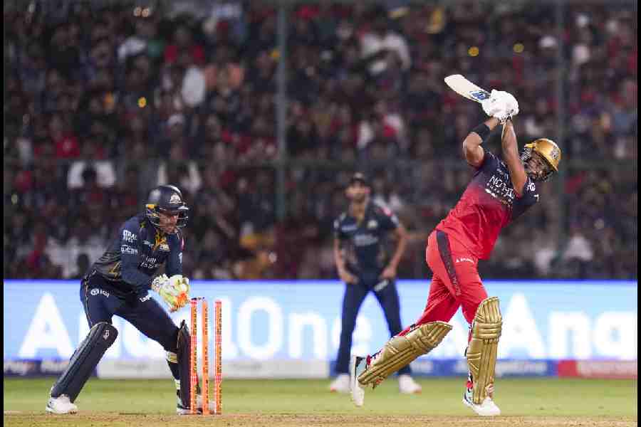 Royal Challengers Bengaluru's Devdutt Padikkal being bowled by Gujarat Titans' Rashid Khan