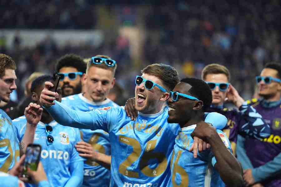 Coventry players celebrate after sealing the Championship title on April 21. 