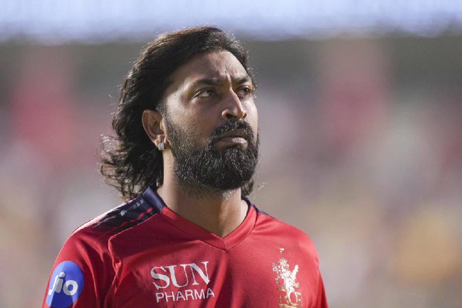Royal Challengers Bengaluru's Krunal Pandya warms up before an Indian Premier League (IPL) 2026 T20 cricket match between Royal Challengers Bengaluru and Gujarat Titans, in Bengaluru, Karnataka, Friday, April 24, 2026.