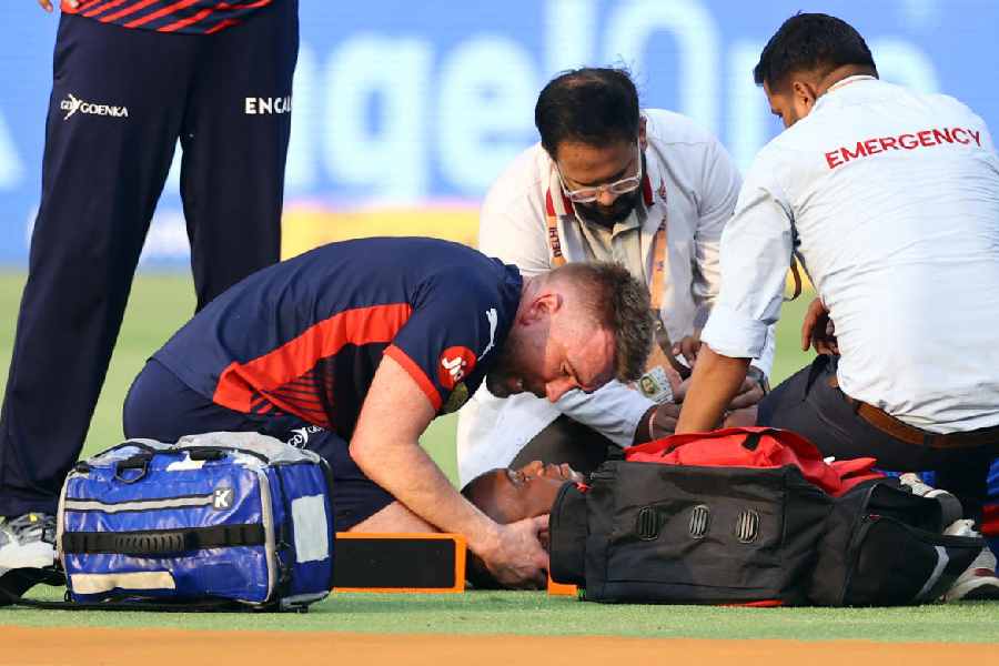 Delhi Capitals' Lungi Ngidi receives medical attention after sustaining an injury
