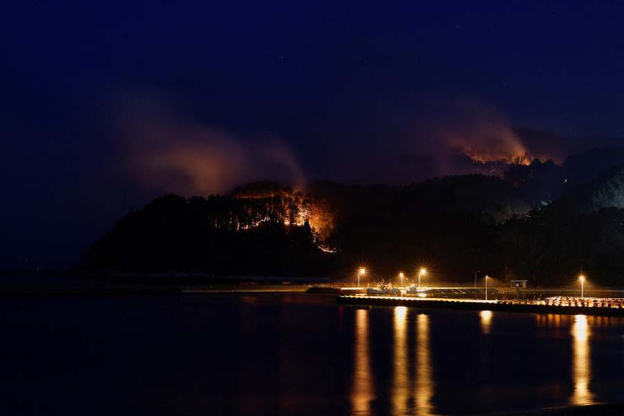 Smoke rises in forest areas as wildfires continue in Otsuchi, Iwate Prefecture, Japan, April 25, 2026.