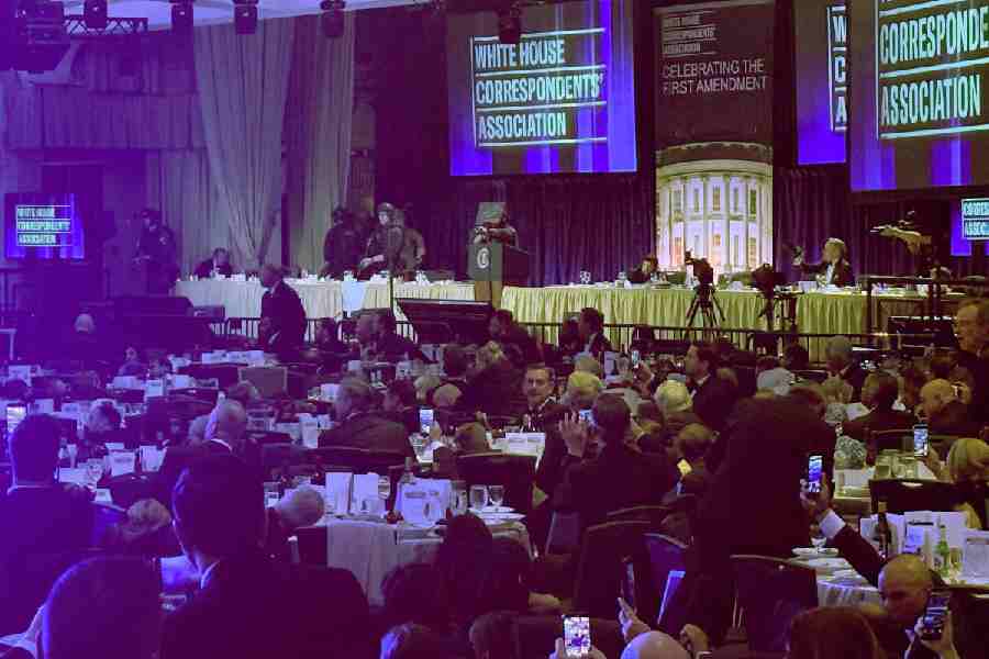 Guests watch from tables after U.S. President Donald Trump and first lady Melania Trump were rushed out of the White House Correspondents' Association dinner by Secret Service agents after a loud, unidentified noise, in Washington, D.C., U.S. April 25, 2026.