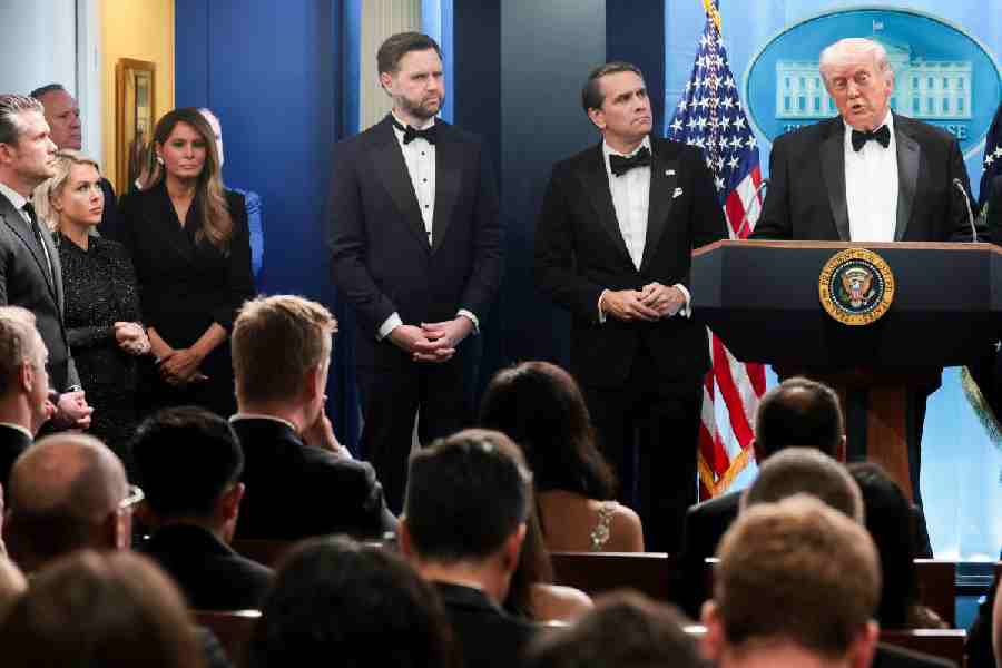 US President Donald Trump speaks next to acting Attorney General Todd Blanche and Vice President JD Vance at a press briefing at the White House, following a shooting incident during the annual White House Correspondents’ Association dinner, in Washington, D.C., U.S., April 25, 2026
