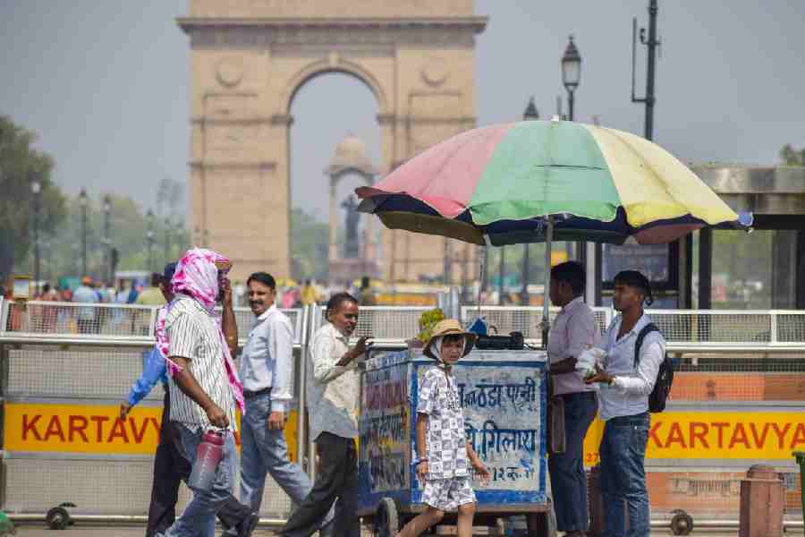 A vendor sells drinking water on a hot summer day, near the India Gate in New Delhi, Monday, April 28, 2025.