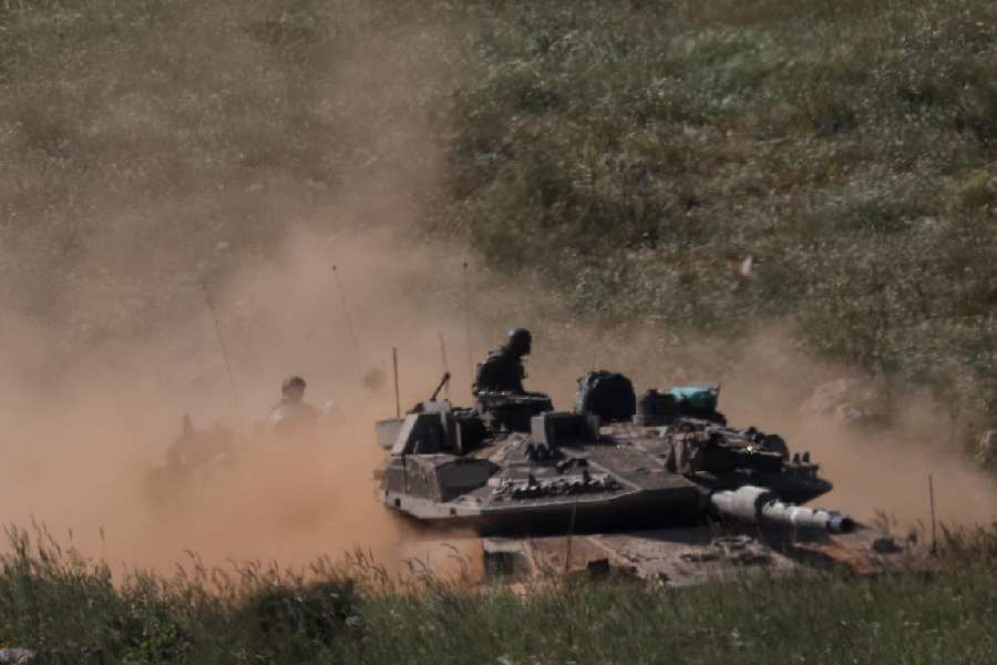 Armoured vehicles in Lebanon, as seen from the Israeli side of the Israel-Lebanon border, in northern Israel, April 25, 2026.