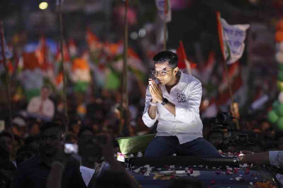 Abhishek Banerjee greets supporters during a road show, ahead of the second phase of the Bengal Assembly elections, in Howrah district on Saturday. (PTI picture)