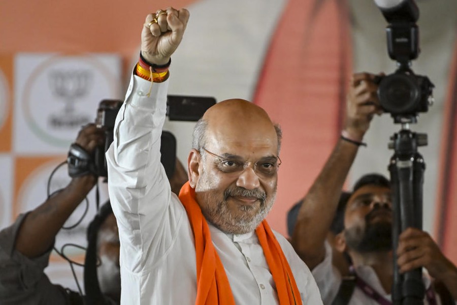 Union Home Minister Amit Shah greets the gathering during a public meeting amid the ongoing West Bengal Assembly elections, at Ranaghat, in Nadia district, Sunday, April 26, 2026.