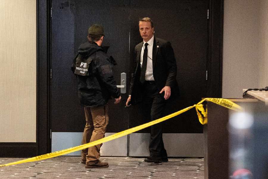 FBI personnel patrol the venue, following a shooting incident during the annual White House Correspondents' Association dinner, in Washington, D.C., U.S., April 25, 2026.
