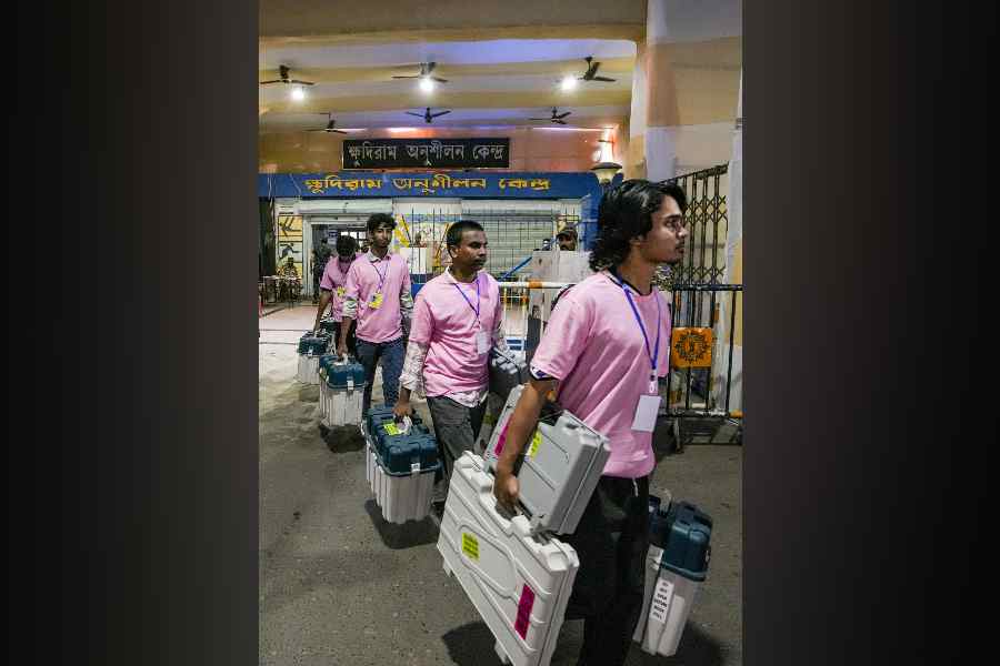  Polling officials leave after collecting Electronic Voting Machine (EVM) and Voter Verifiable Paper Audit Trail (VVPAT) units, at a distribution centre for voting in the second phase of the West Bengal Assembly elections, in Kolkata, Tuesday, April 28, 2026.