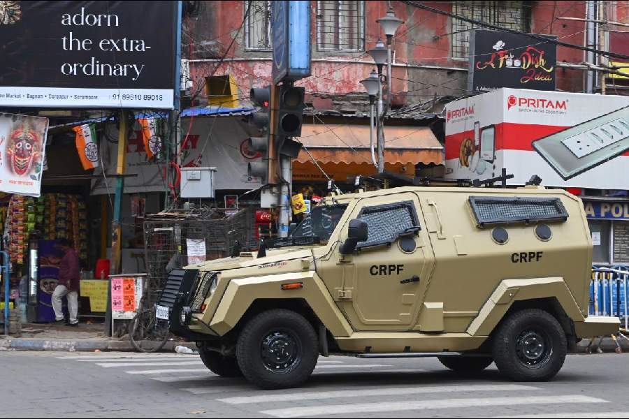 An armoured CRPF vehicle patrols Bhabanipur on Tuesday, on the eve of polling. 