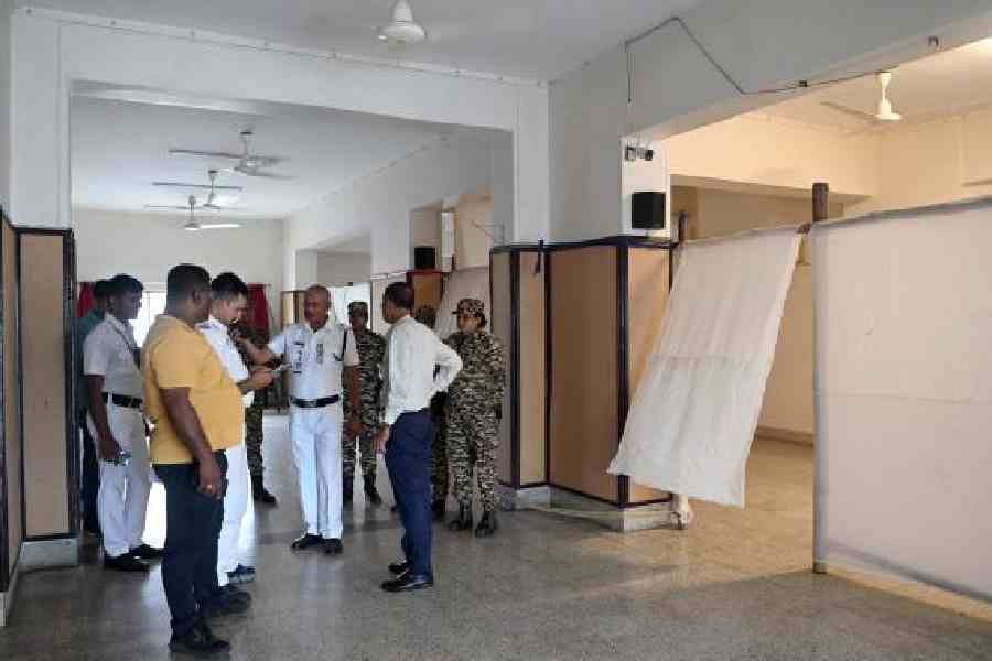 A police team at the booth at Asha Co-operative, under the Rashbehari constituency