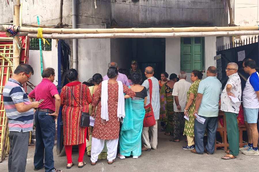 Voters queued up outside Netaji Nagar Women's College in Ward 98 on Wednesday morning