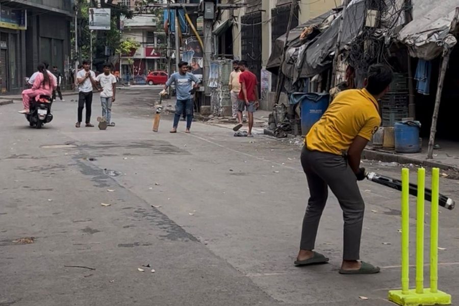 In another lane, a group of young men turned the empty road into a makeshift cricket pitch, their laughter cutting through the silence.