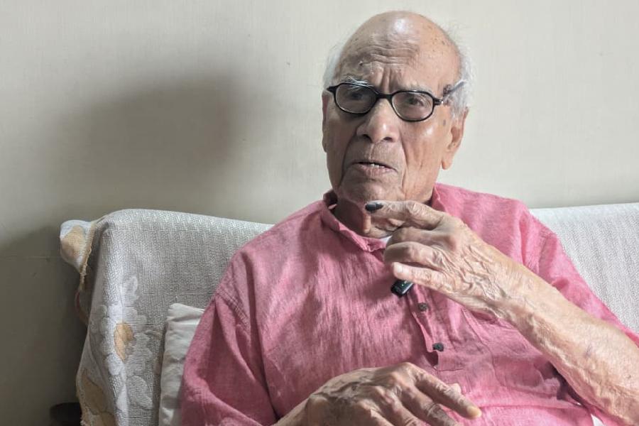 Hitendra Chandra Dutta, 99, shows his inked finger at his home in Gariahat