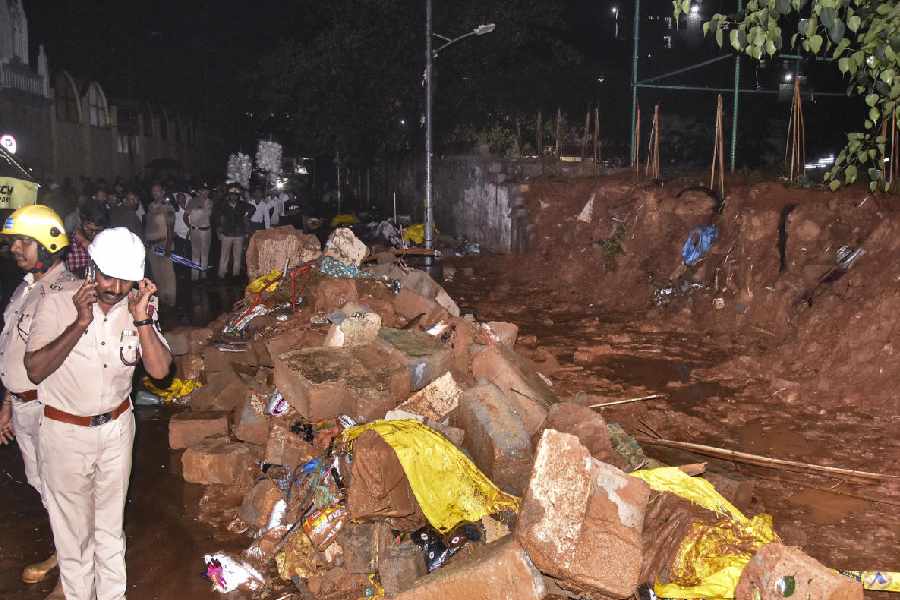 Police personnel at the site after a wall collapse following heavy rain, at Bowring Hospital, in Bengaluru, Wednesday, April 29, 2026. At least seven people were reported dead.