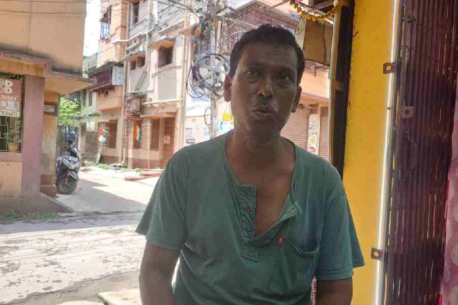 Ranen Mahata at home on Wednesday, while his wife and daughter went to vote