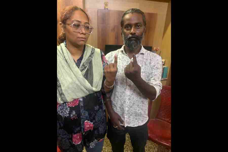 Kahkashan, who could not vote, with her husband Arfat Khan, who did