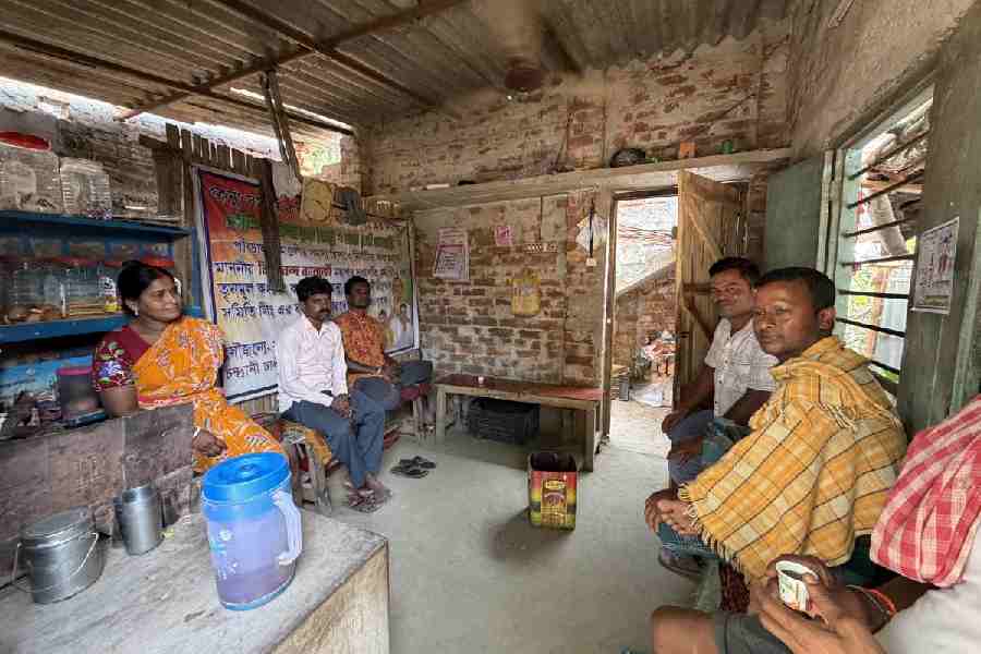 Villagers engage in a ‘chai pe charcha’ at the tea stall of Seema Dakua at Uttar Kailashpur on Wednesday