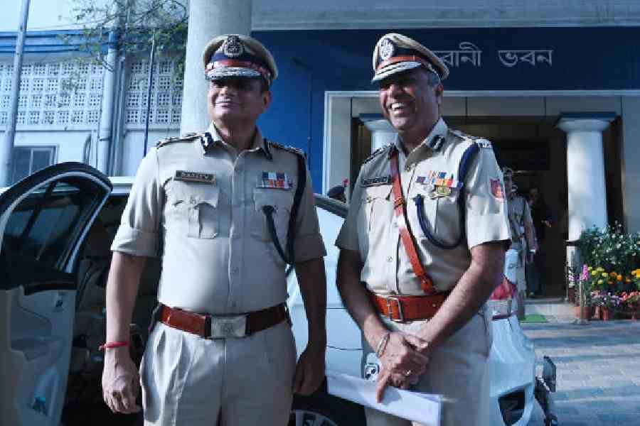 Bengal’s new DGP Peeyush Pandey (right) with outgoingpolice chief Rajeev Kumar outside Bhabani Bhawan on Saturday afternoon. Picture by Bishwarup Dutta