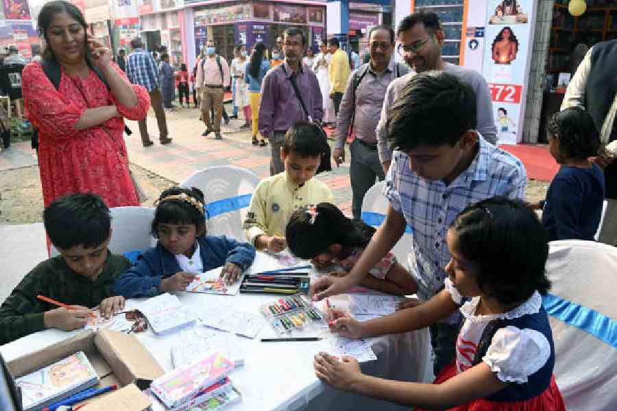 Kids at the Children’s Book Trust’s stall at the Book Fair on Saturday. Pictures by Sanat Kr Sinha