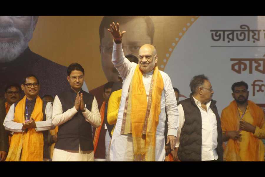 Amit Shah greets the crowd in Bagdogra on Saturday. 