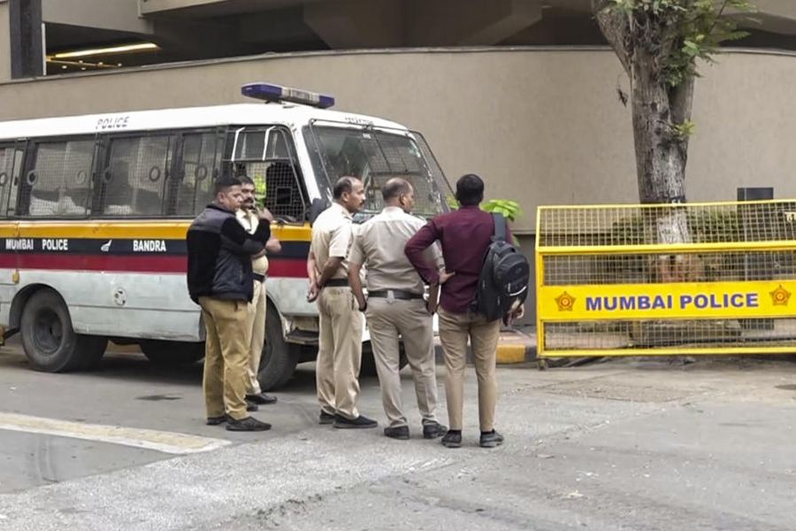 Security personnel keep vigil after unidentified persons opened fire outside film maker Rohit Shetty's residence in western suburbs of Mumbai's Juhu, Sunday, Feb. 1, 2026.