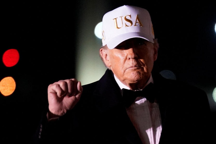 US President Donald Trump gestures after disembarking from Air Force One on his arrival at Palm Beach International Airport in West Palm Beach, Florida, US, January 31, 2026.
