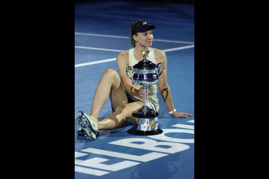 Elena Rybakina with the Daphne Akhurst Memorial Cup after winning the Australian Open final against Aryna Sabalenka on Saturday.