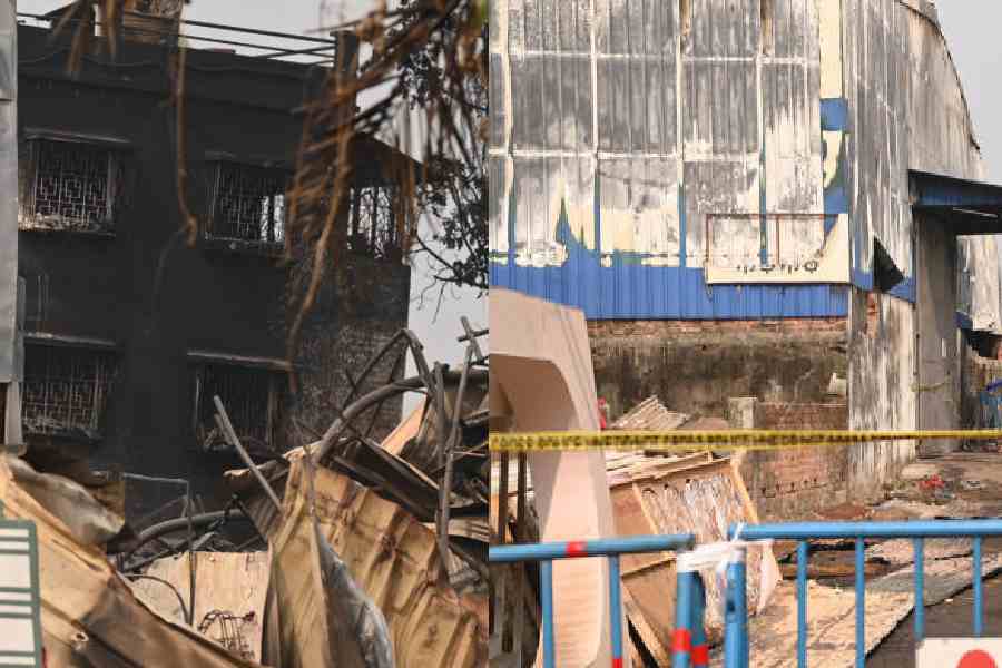 A soot-covered building next to the fire-ravaged godowns            in Anandapur on Sunday. Picture by Bishwarup Dutta 